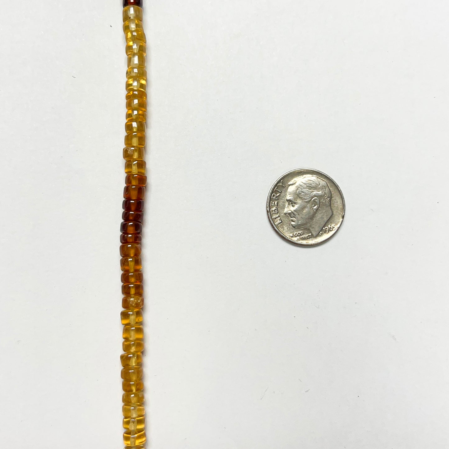 2.5–3.5mm x 5mm Smooth Hessonite Tires 14 inch ~134 pcs/strand
