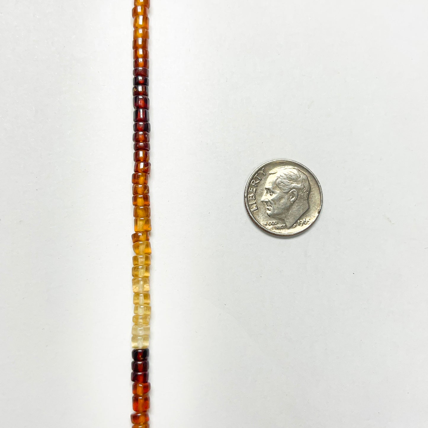 2–3mm x 4–4.5mm Smooth Hessonite Tires 14.5 inch ~148 pcs/strand