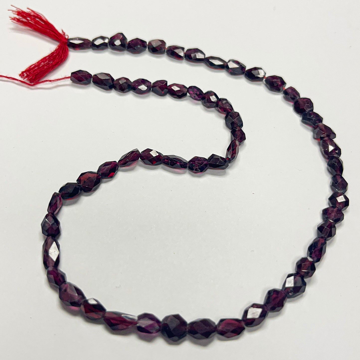 8–11mm x 6–7.5mm Faceted Oval Garnet 17 inch ~57 pcs/strand