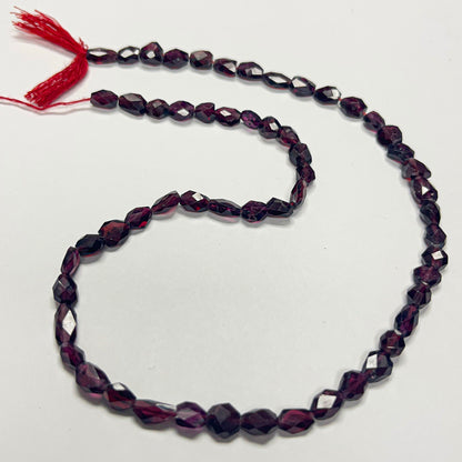 6–6.5mm x 4–4.5mm Faceted Flat Oval Garnet 14 inch ~54 pcs/strand