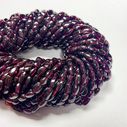 7–7.5mm x 5–5.5mm Smooth Oval Garnet 14 inch ~51 pcs/strand