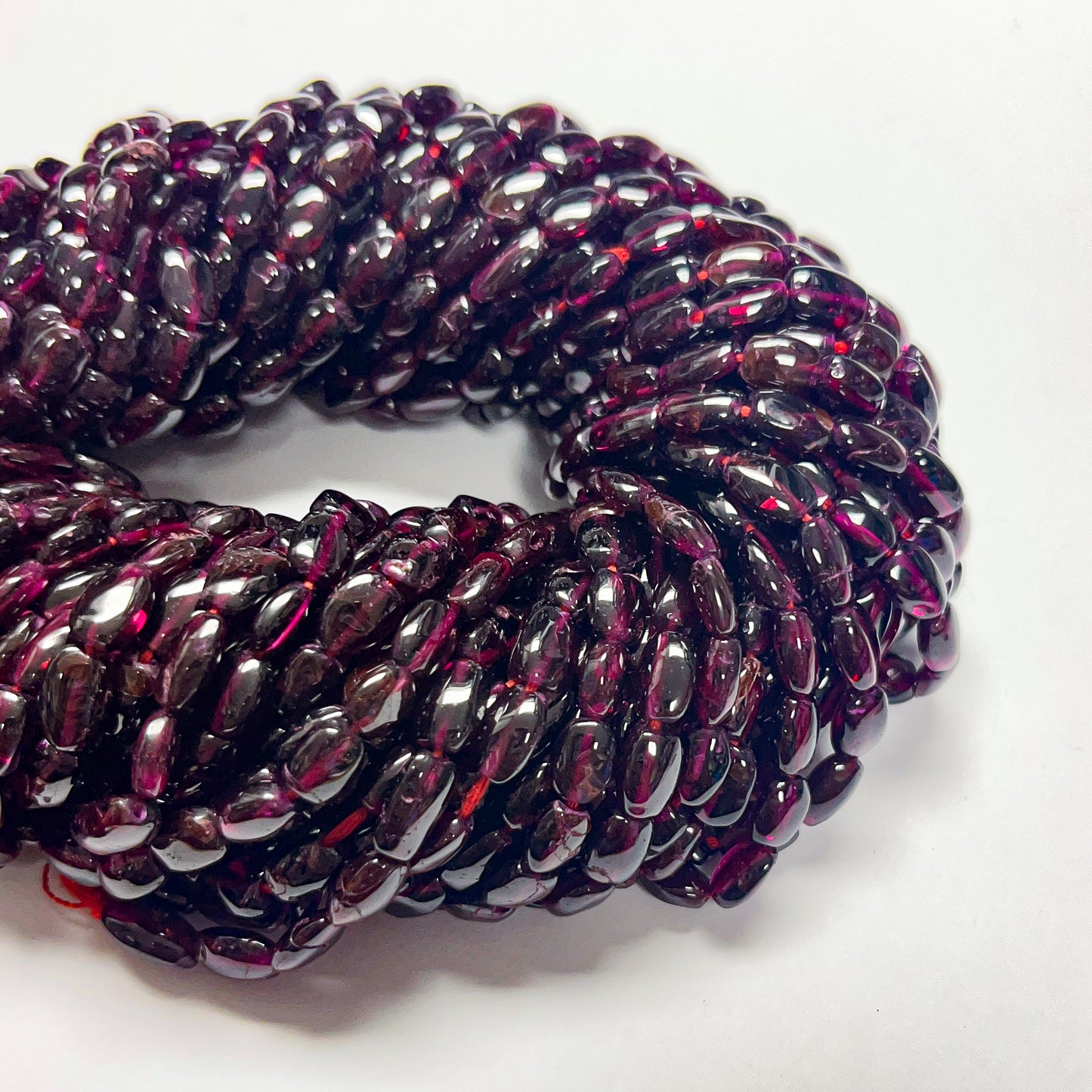 7–8mm x 5.5–6mm Smooth Oval Garnet 14 inch ~47 pcs/strand