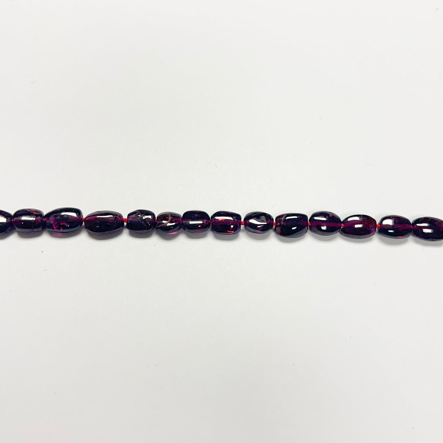 7–8mm x 5.5–6mm Smooth Oval Garnet 14 inch ~47 pcs/strand
