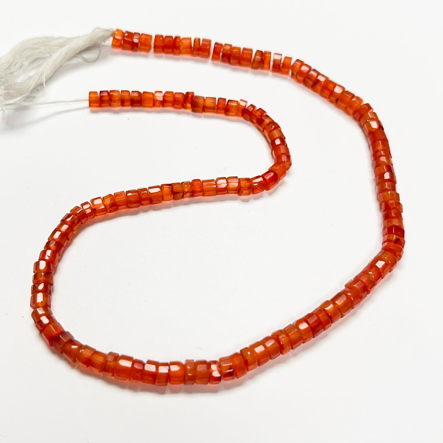 1.5–3mm x 4–4.4mm Faceted Carnelian Tires 15 inch ~65 pcs/strand