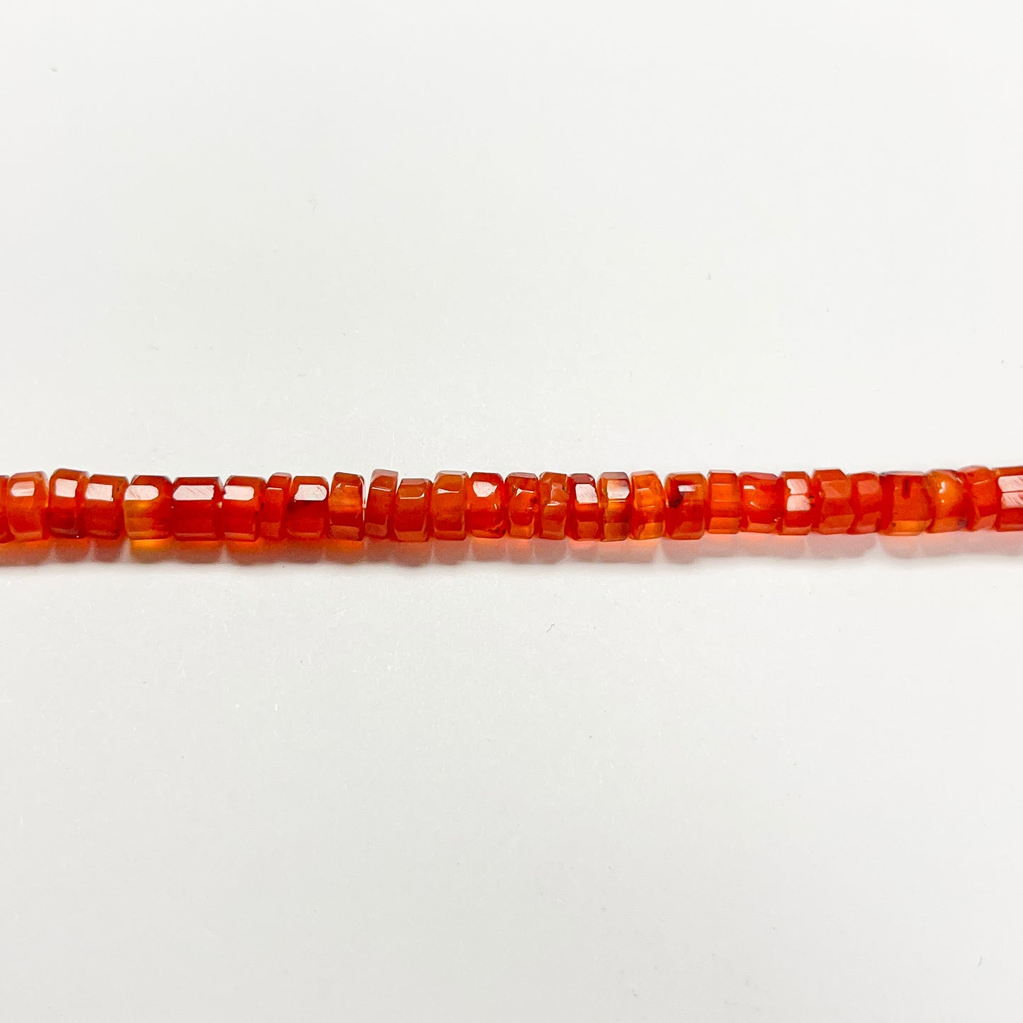 1.5–3mm x 4.5–5mm Faceted Carnelian Tires 14 inch ~128 pcs/strand