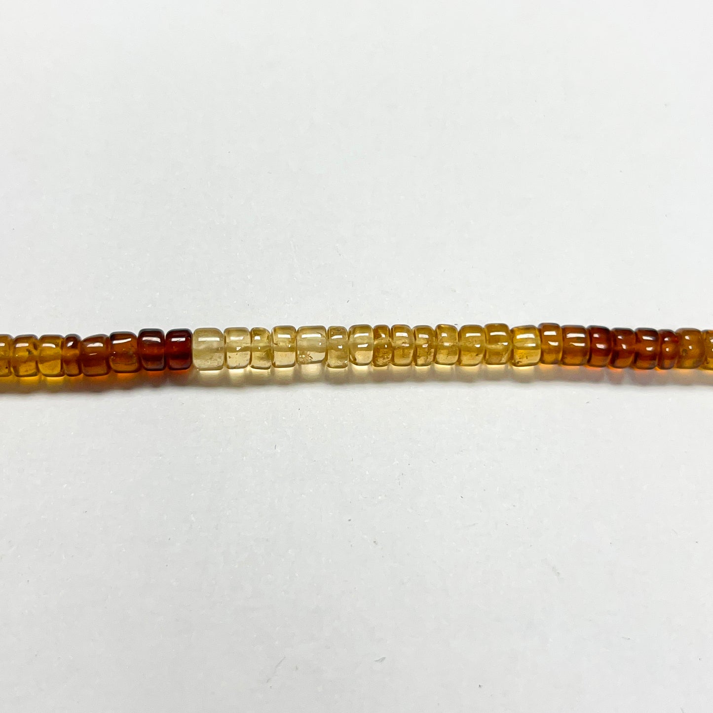 2–3mm x 4–4.5mm Smooth Hessonite Tires 14.5 inch ~148 pcs/strand