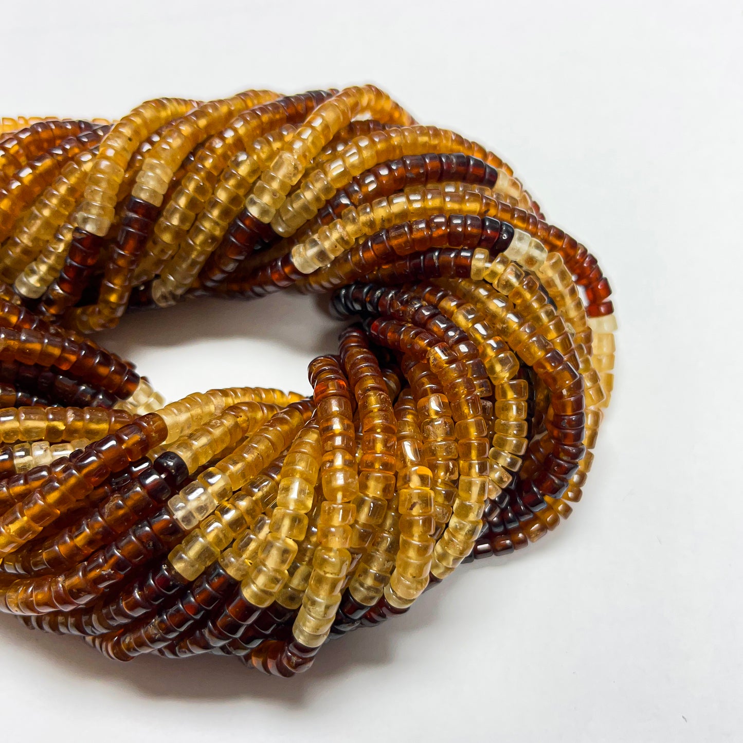 2.5–3.5mm x 5mm Smooth Hessonite Tires 14 inch ~134 pcs/strand