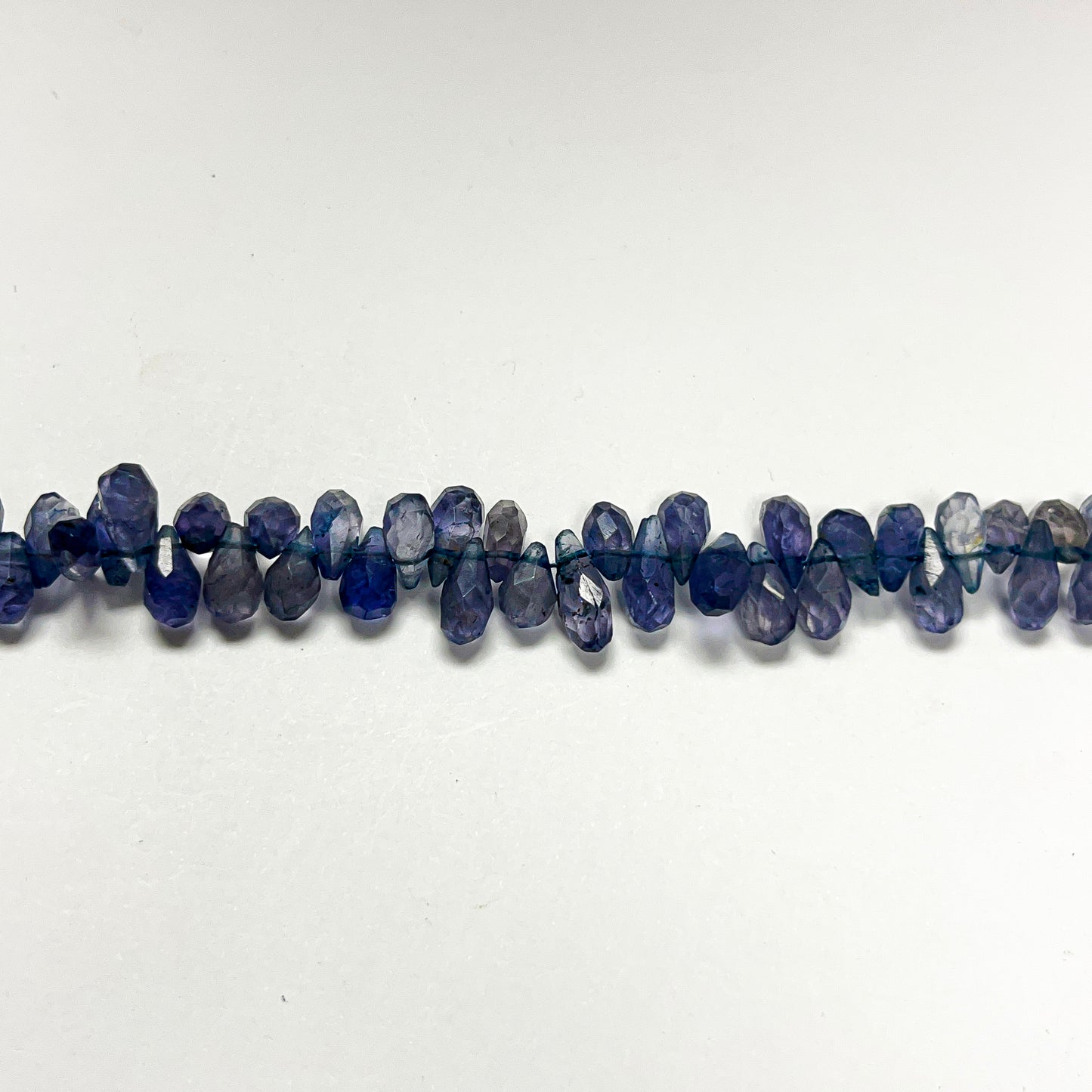 4mm x 6–9mm Faceted Iolite Drops 14 inch ~130 pcs/strand